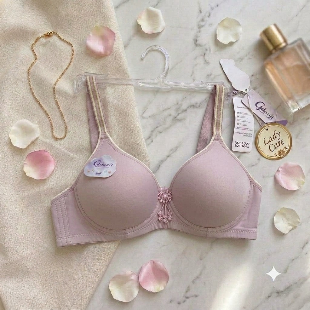 soothing mint green bra designed with sporty striped straps and a sweet floral charm for daily wear.