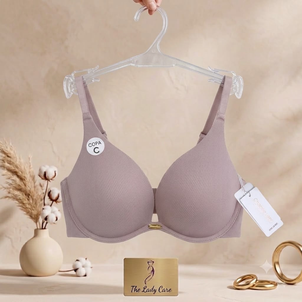 Premium textured ribbed fabric
«delicate
gold- tone center charm, supportive contoured cups, and comfortable adjustable straps.