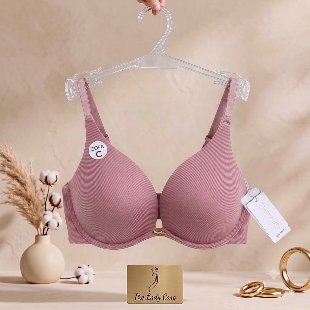 Premium textured ribbed fabric
«delicate
gold- tone center charm, supportive contoured cups, and comfortable adjustable straps.